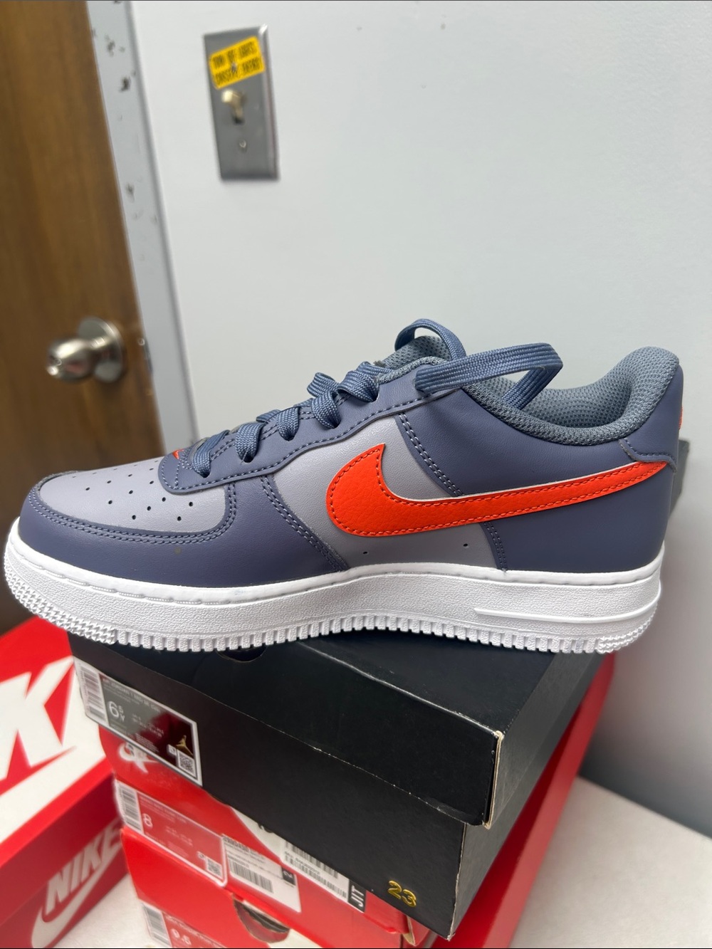 Nike Kids Low-Top Sneaker in Gray with Orange Swoosh